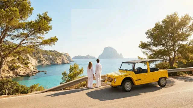 Yellow Citroën Mehari electric tour on Ibiza coastal road at sunset — Retro Rides